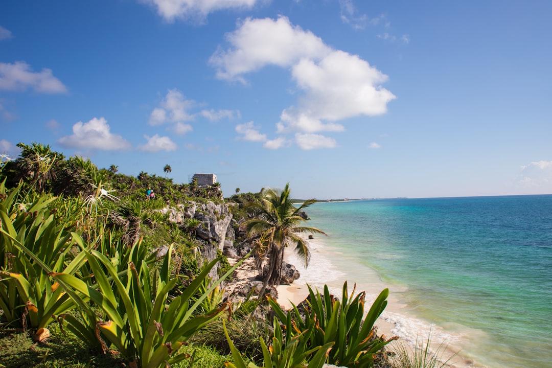 Tulum Mexico is everyones dream of the perfect tropical vacation - cliffs,Mayan Ruins, coconut palms, white sand, brisk breezes and Turquoise Sea.